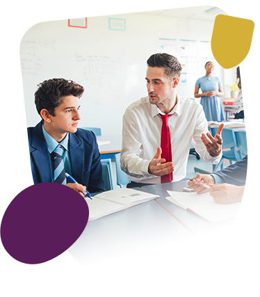 Male teacher and male pupil in class